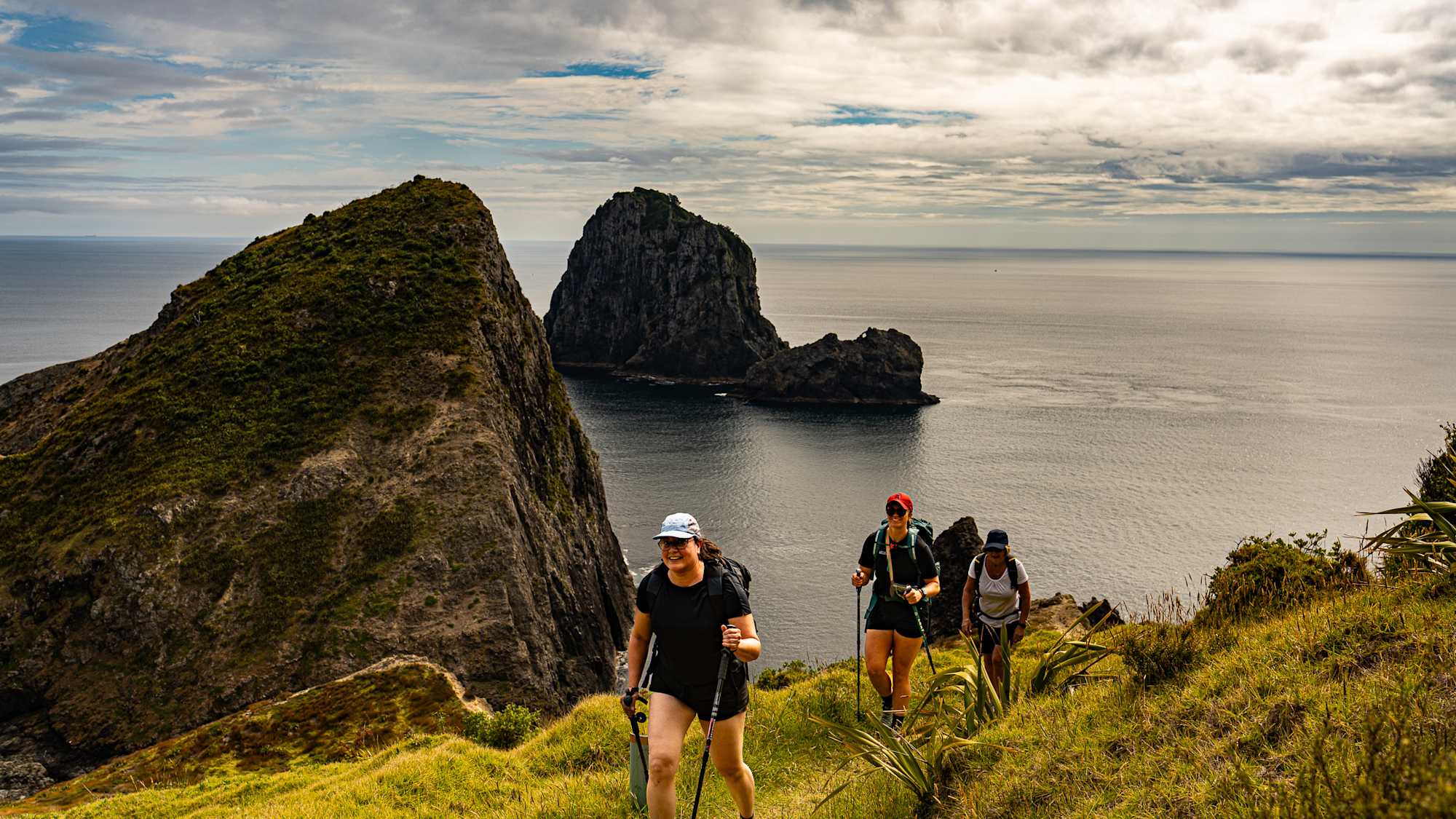 Active Adventures guide with guests on Northland Adventure at Mangawhai Heads